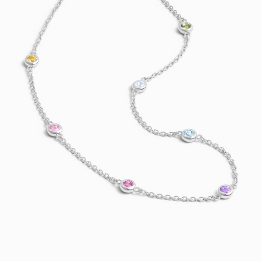 Silver necklace with colorful gemstones on a white background