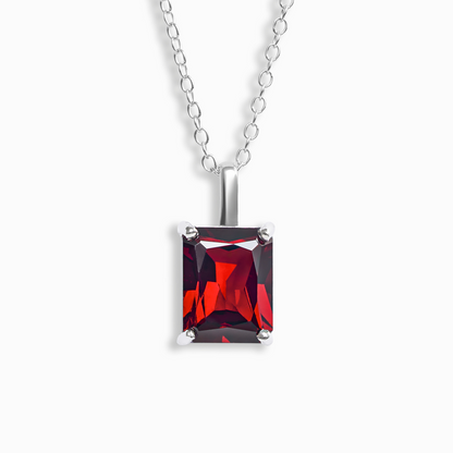 Necklace with a red garnet gemstone pendant on a white background