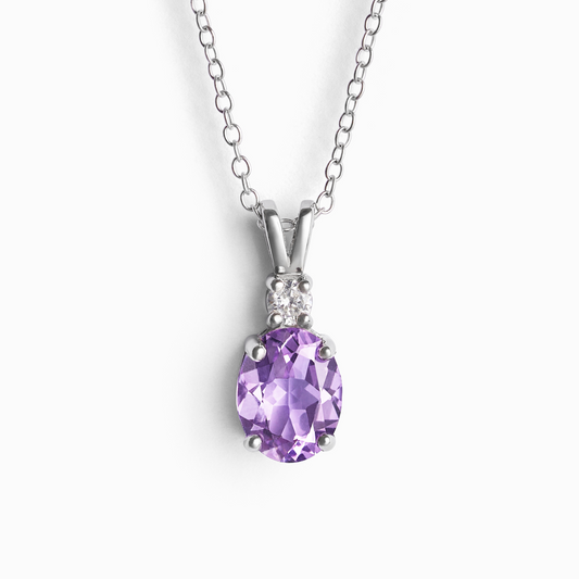 Purple amethyst gemstone silver necklace on a white background