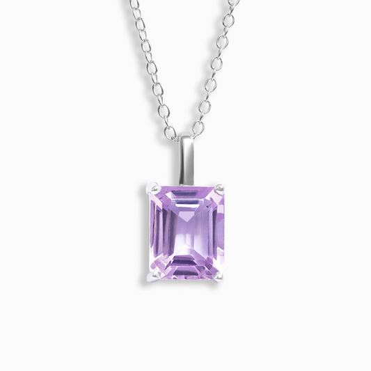 Purple amethyst gemstone necklace on a white background