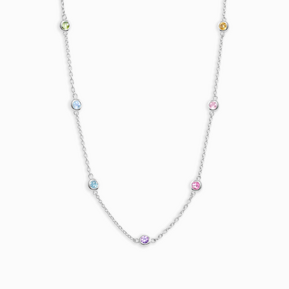 Necklace with small multicolored gemstones on a white background