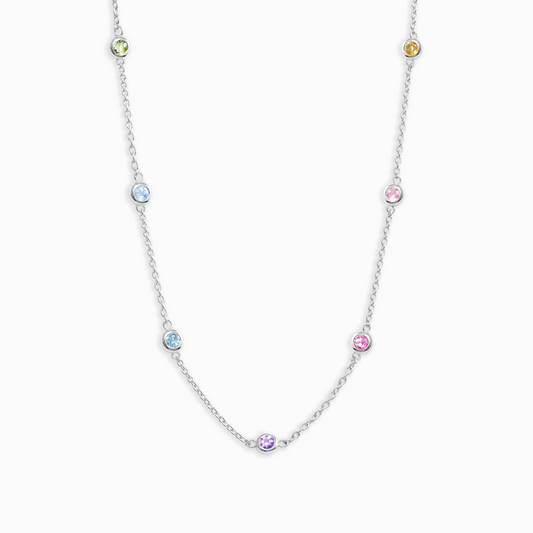 Necklace with small multicolored gemstones on a white background