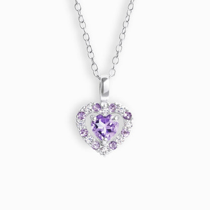 Heart-shaped necklace with a purple amethyst gemstone on a white background