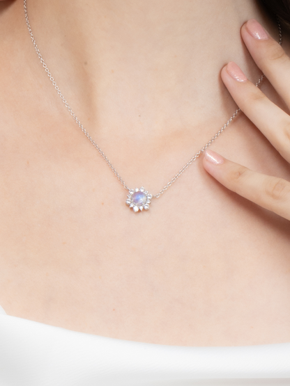 Necklace with a moonstone pendant worn by a lady