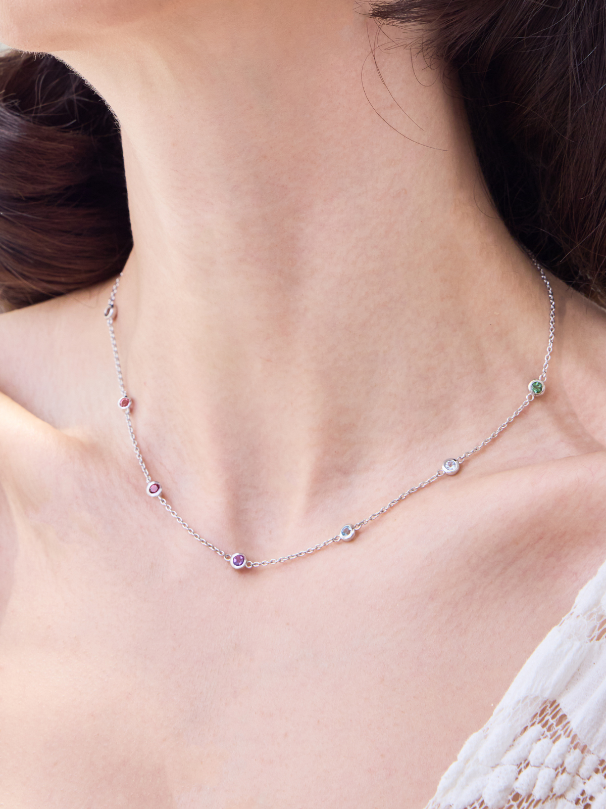 Necklace with colourful gemstones worn by a women
