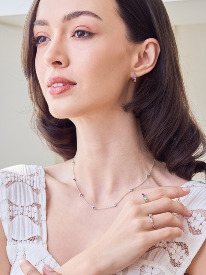 Woman wearing a necklace and ring, close-up of jewelry