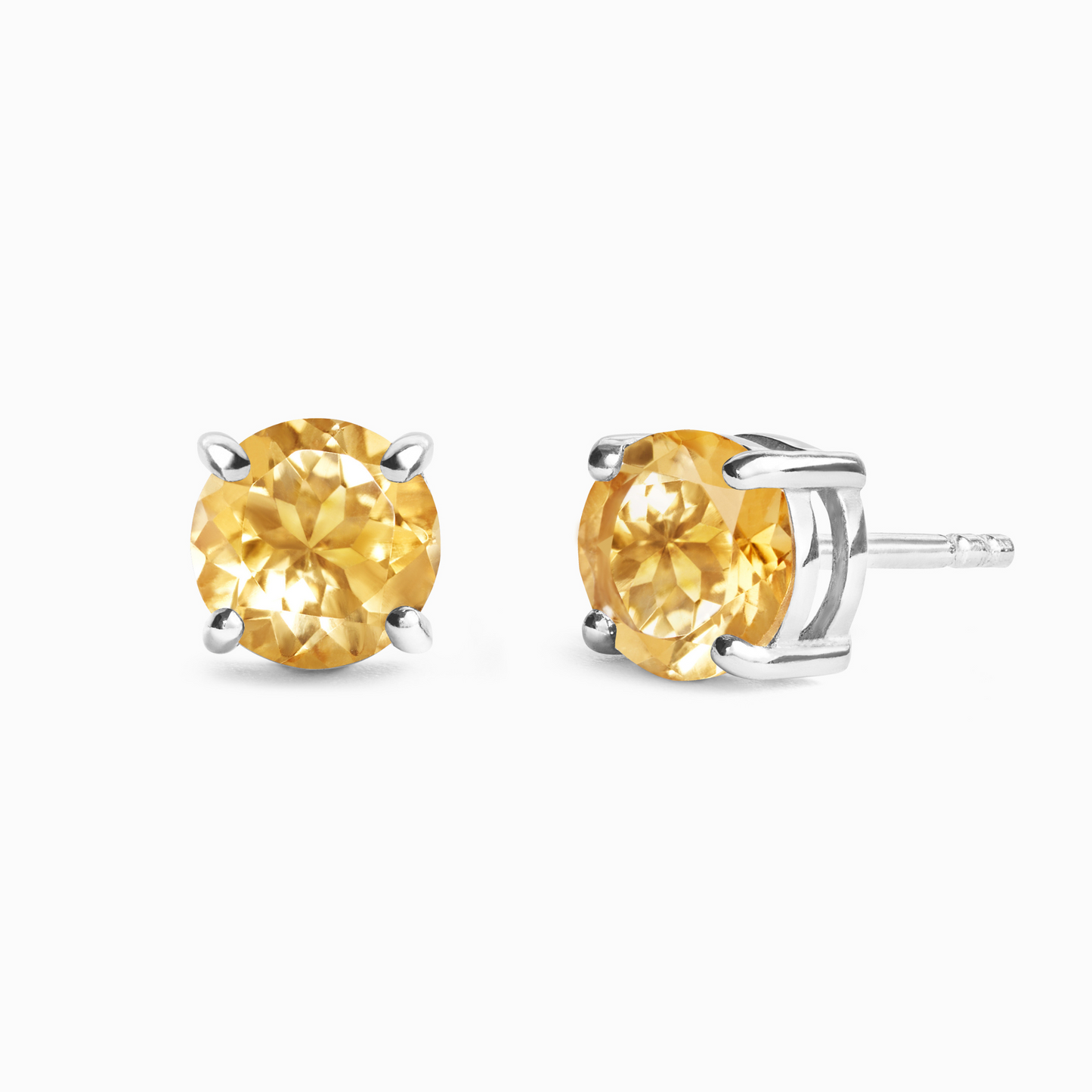 Pair of yellow citrine gemstone stud earrings on a white background
