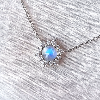 Silver Necklace with a moonstone pendant on a light gray background