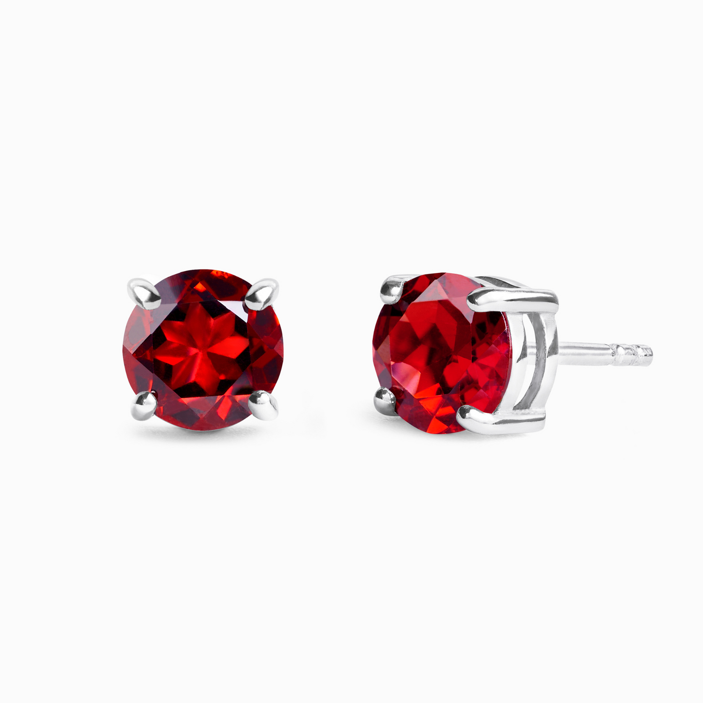 Red garnet gemstone stud earrings on a white background