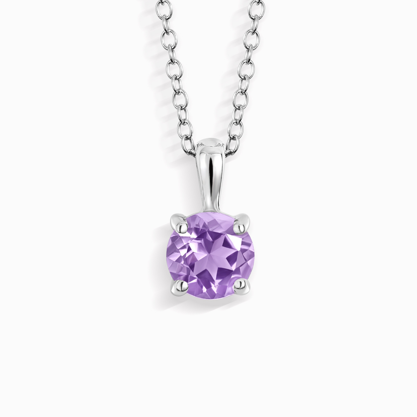 Purple amethsyt gemstone pendant on a silver chain against a white background