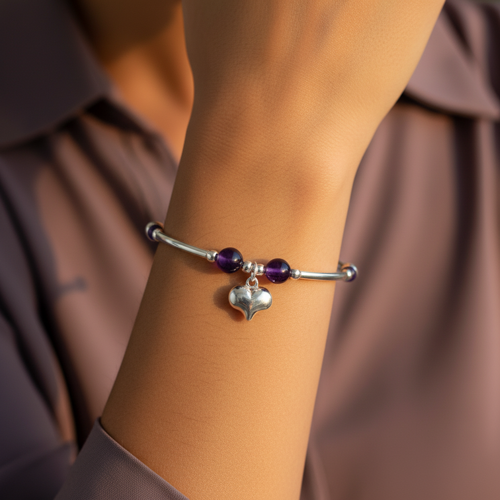 Woman wearing a Heart Charm Amethyst Sterling Silver Women's Stacking Bracelet by My Silver Wish