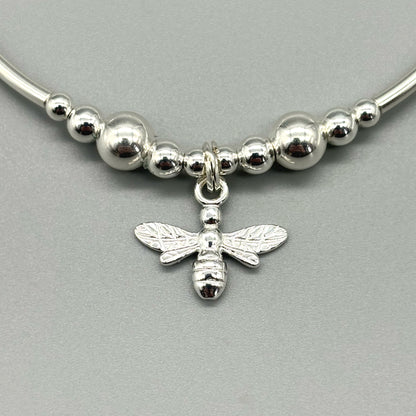 Closeup of bee charm sterling silver stacking bracelet by My Silver Wish