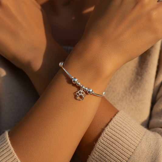 Woman wearing a Dog Paw Charm Sterling Silver Stacking Bracelet for her by My Silver Wish