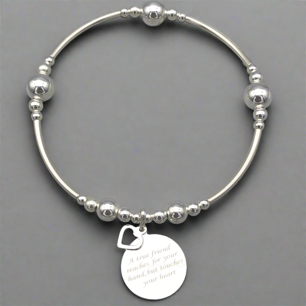 "A true friend reaches for your hand, but touches your heart" women's sterling silver stacking bracelet by My Silver Wish