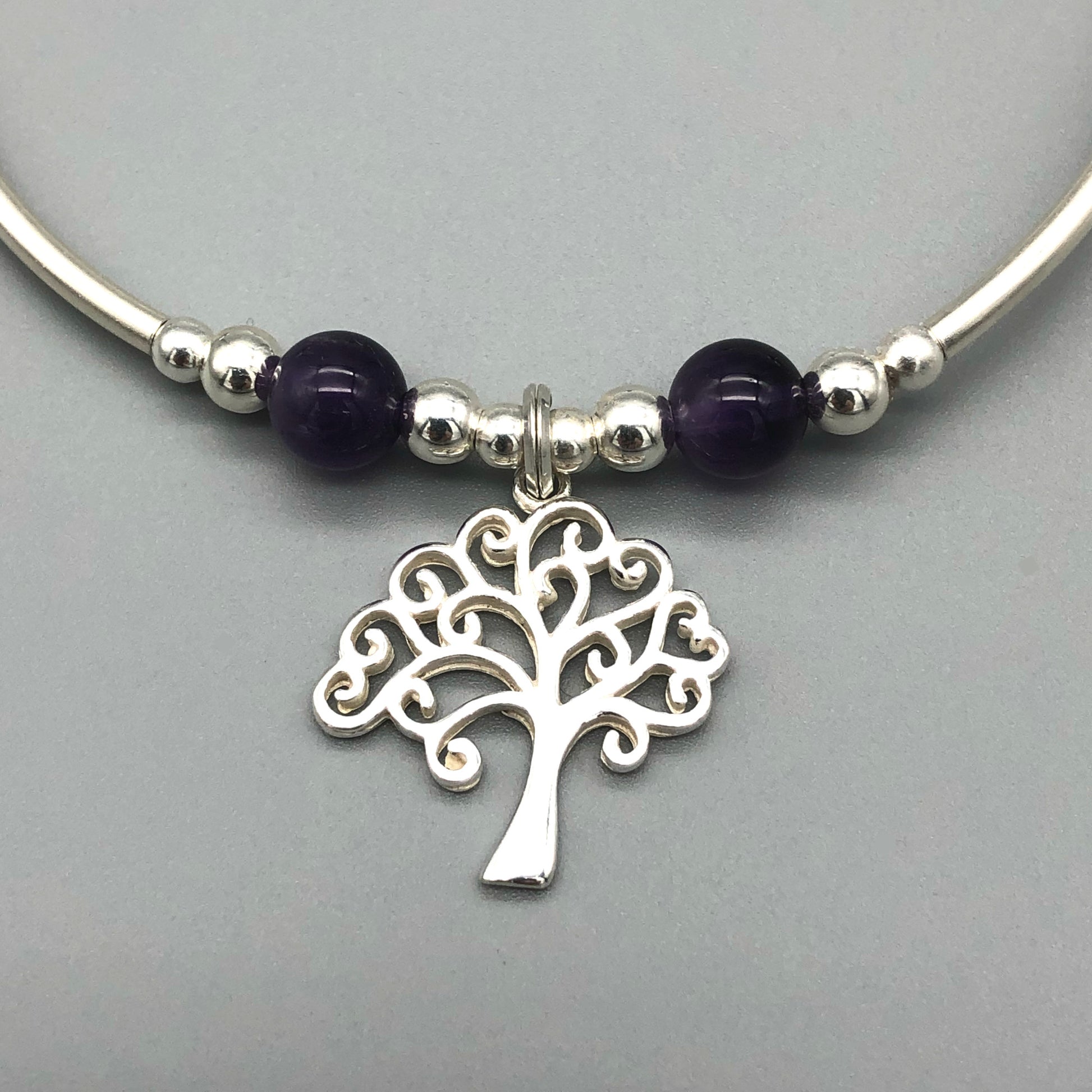 Closeup of Silver Tree Charm & Amethyst Healing Crystal Women's Stacking Bracelet