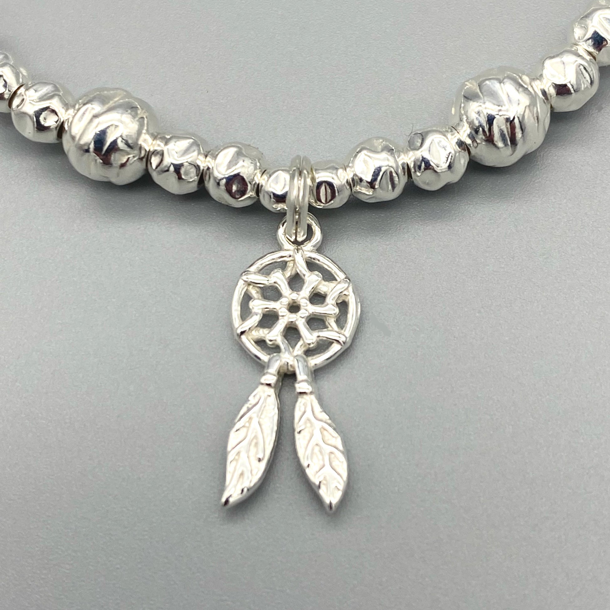 Closeup of Dreamcatcher charm sterling silver stacking bracelet for her by My Silver Wish