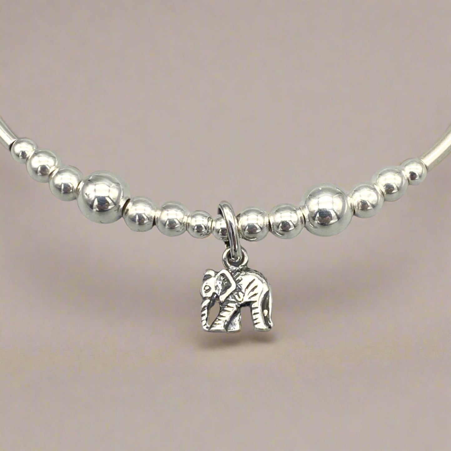 Closeup of Elephant charm sterling silver women's stacking bracelet by My Silver Wish