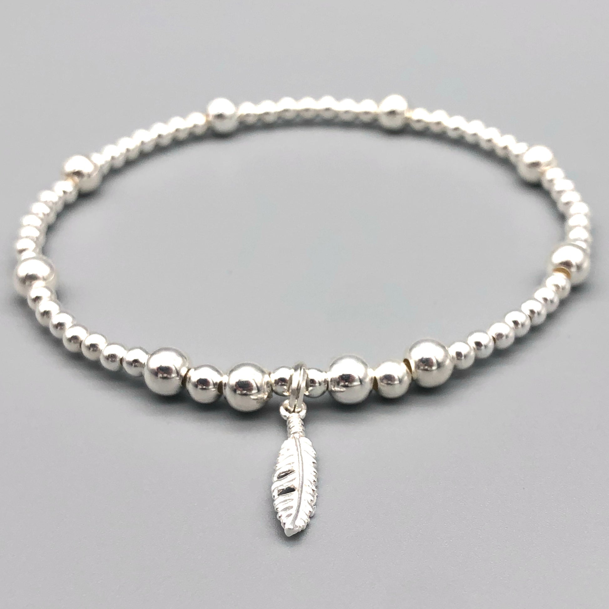 Feather charm women's 925 sterling silver stacking bracelet by My Silver Wish