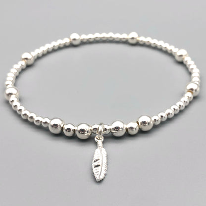 Feather charm sterling silver stacking charm bracelet by My Silver Wish