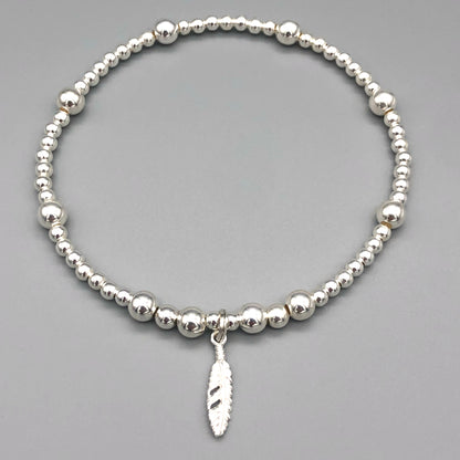 Feather charm sterling silver stacking charm bracelet by My Silver Wish